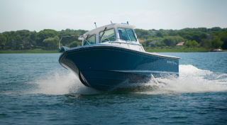 Blue speedboat showcasing Wynne swing out windows.