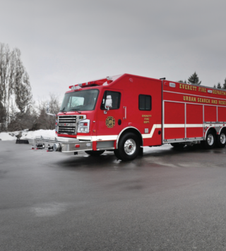 A red firetruck from Rosenbauer showcasing Wynne stationary windows.